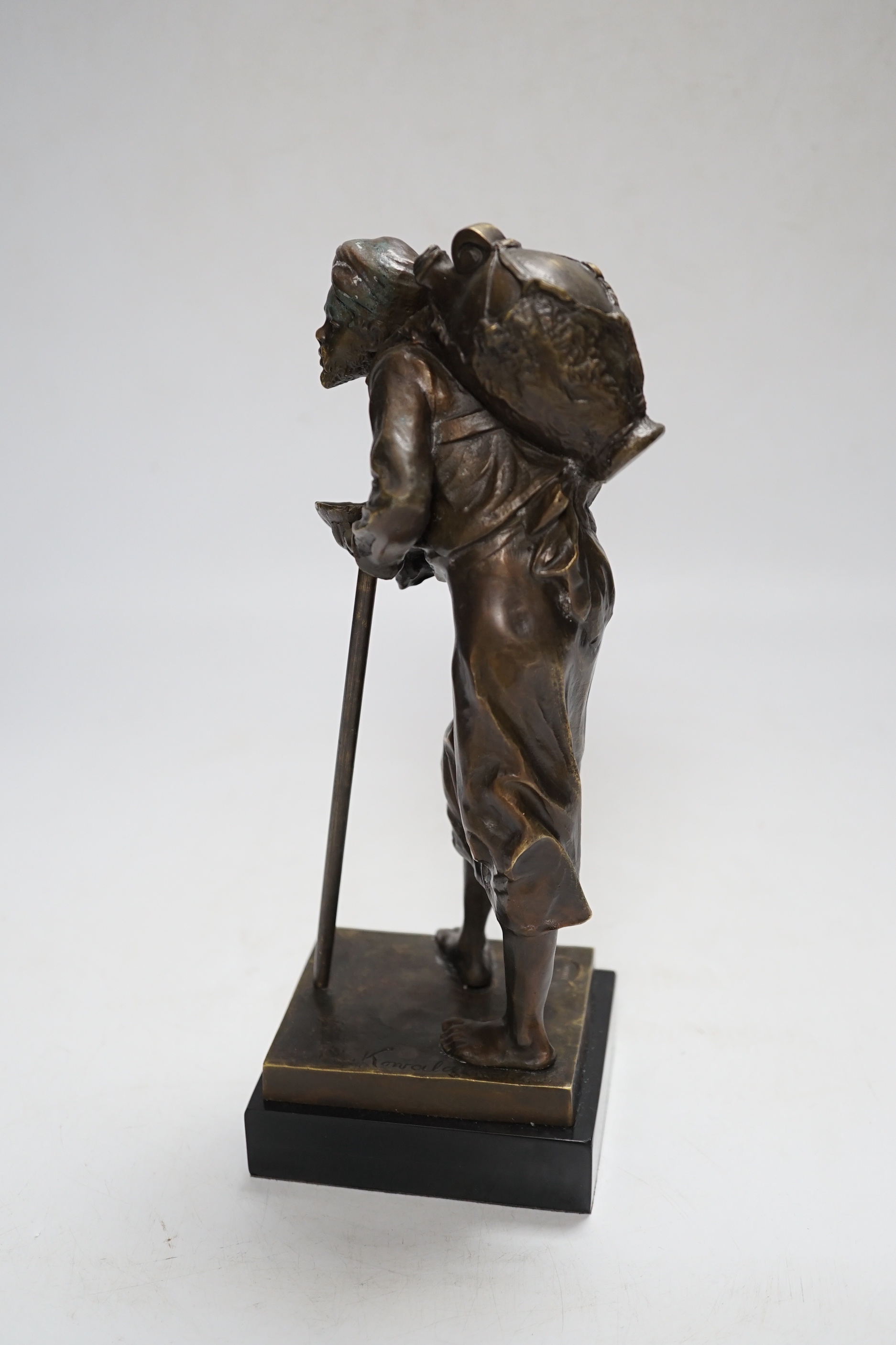 After Paul Ludwig Kowalczewski, a bronze of an African wine seller, 24cm